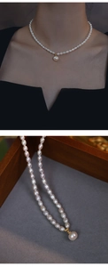 Detail of freshwater rice pearl necklace with gold clasp in a wooden jewelry box