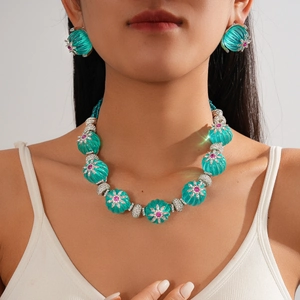 Elegant turquoise beaded flower jewelry set with sparkling rhinestones and silver finish