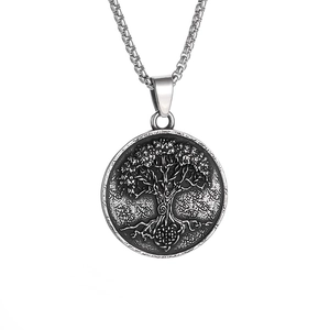 Detailed view of Viking Tree of Life round pendant in vintage silver steel with box chain