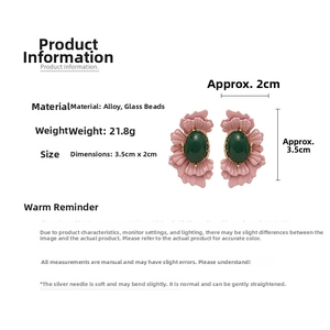 Detail view of pink flower earrings with green glass stone and size dimensions
