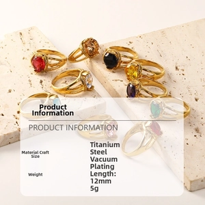 Detail of 18K gold plated titanium steel rings with colorful oval zircon gemstones