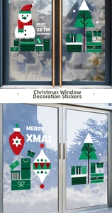 Detailed view of snowman and Christmas tree window decals on a festive glass door