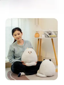 Front and back detail of a fluffy white Persian cat plush toy with realistic yellow eyes