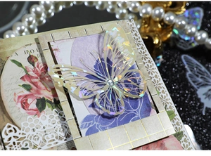 Detailed macro view of vintage laser-cut butterfly stickers with radiant floral PET texture