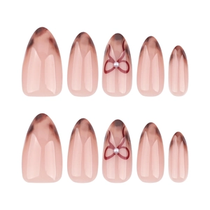 Elegant almond leopard print press-on nails with red bow and pearl accents