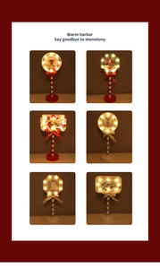 Detail view of various Christmas LED wooden signs with reindeer and santa patterns