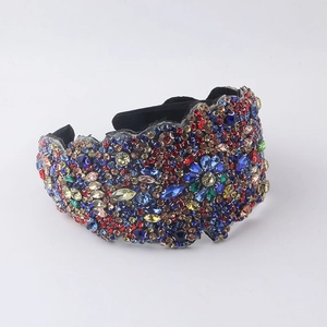 Detailed macro view of baroque headband with colorful rhinestones and floral gem patterns