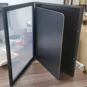 Detail view of the open black jersey display frame with magnetic closure and clear cover