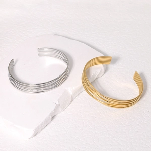 Minimalist multi-layer open cuff bracelet in polished gold and silver stainless steel