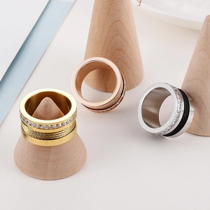 Detailed view of cable texture rings with Roman numerals and cubic zirconia inlay