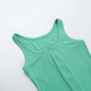 Detail of mint green ribbed knit fabric with metallic snap button closure on cropped top