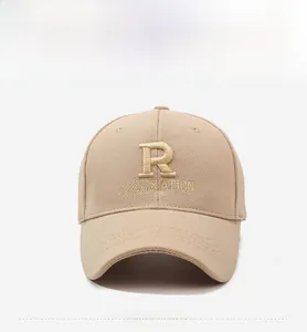 Detailed embroidery of letter R on khaki baseball cap with high quality stitching