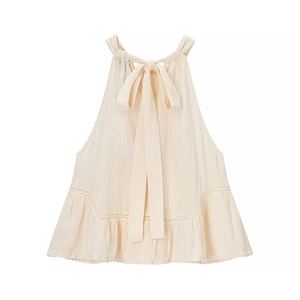 Off-white halter neck sheer blouse featuring back bow tie and delicate ruffle lace hem