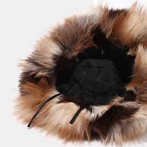 Women's faux fur bucket hat with warm black quilted lining and adjustable strap
