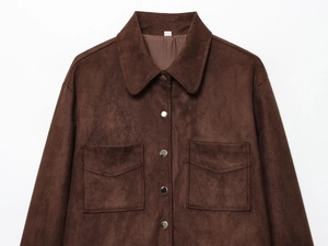 Detail of dark brown faux suede jacket with silver buttons and large symmetric pockets