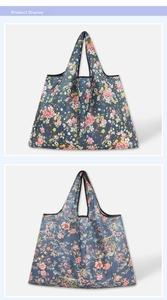 Detail of floral waterproof shopping bags with reinforced edges and foldable nylon fabric