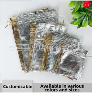 Metallic drawstring pouches in gold and silver colors with various sizes for jewelry