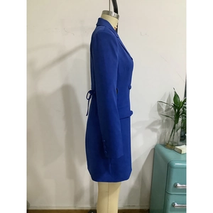 Detail view of royal blue blazer dress with waist-cinching bow and double-breasted buttons
