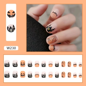 Detail view of W230 Halloween press on nails with pumpkin, ghost, and spider web designs