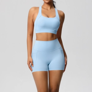 Light blue yoga set with racerback sports bra and high-waist shorts for fitness training