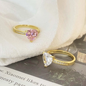Gold-plated engagement rings with pink and white heart-shaped cubic zirconia stones