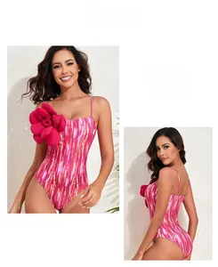 Close-up of pink striped swimsuit featuring a large 3D rose flower on the chest detail