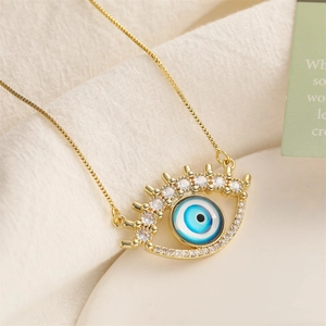 Gold Evil Eye pendant necklace featuring sparkling micro-pave zircons and blue eye charm
