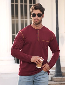 Detail of wine red Henley shirt featuring button collar, chest pocket and knit texture