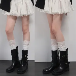 White lace trim slouch socks for women in Japanese ballet style paired with black boots