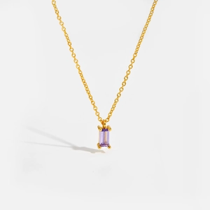 Elegant gold chain necklace featuring a rectangular purple gemstone pendant on white background
