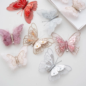 Set of sequined butterfly ornaments with feathers and pearls for Christmas tree decoration