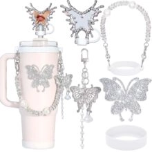 Pink tumbler accessory kit with silver butterfly charms, pearl chain, and silicone rings
