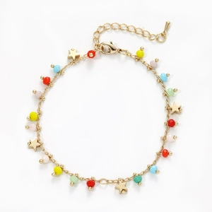 Detail of gold chain bracelet with colorful beads and hanging star charms and clasp