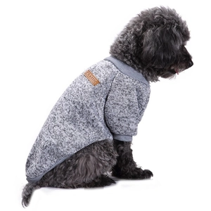 Macro view of grey knitted dog sweater featuring classic leather patch detail