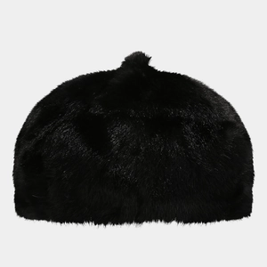 Close-up of black faux fur beret showing soft plush texture and fluffy round design