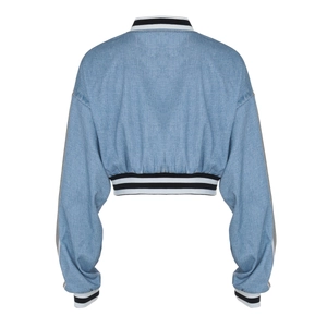 Rear view of light blue denim bomber jacket with striped ribbed cuffs and hemline details