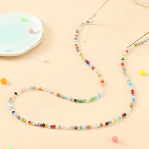 Detailed shot of multi-colored crystal beads on a stylish eyewear chain with metal clasps