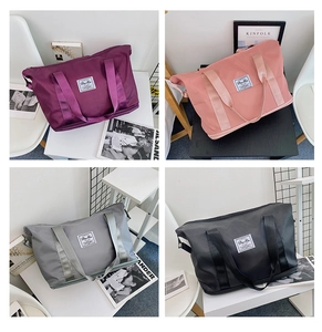 Collection of large travel tote bags in purple, pink, gray, and black for gym and yoga