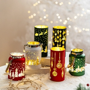 Festive Christmas hollow metal lanterns with LED glow for holiday table decor