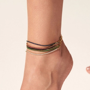 Elegant multi-layered gold stainless steel anklet with colorful zircon stones on female ankle