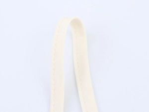 Close-up of beige canvas straps with reinforced stitching detail for vacation set