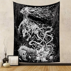 Detail of bohemian black and white skull tapestry hanging on a textured wall for room decor