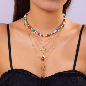 Detail of multi-layered Christmas necklace with polymer clay beads and festive charms