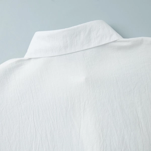 Detail of white shirt collar with premium crinkle texture fabric and fine stitching