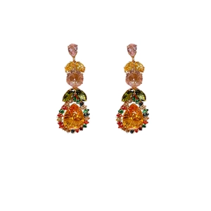 Elegant gold earrings with colorful pear-cut gemstones and leaf-shaped crystal accents