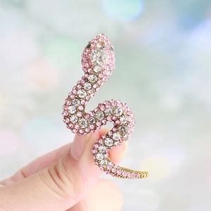 Elegant gold snake brooch featuring sparkling pink and clear rhinestones for women