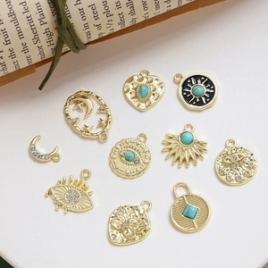Golden alloy DIY jewelry pendants set with Egyptian sun eye and turquoise star motifs