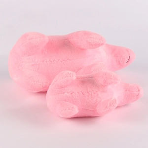 Macro view showing the soft plush bottom texture of pink stuffed capybara toys