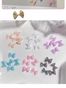 Macro shot of 3D aurora resin bow ties in candy colors for professional nail art designs