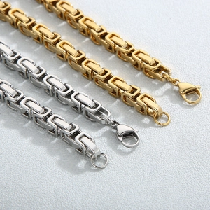 Gold and silver chunky Byzantine chain necklace set with lobster clasp and pave heart charm